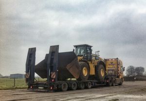 CAT 980K loading shovel on a low loader ready for transport.