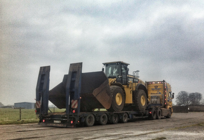 CAT980k loading shovel on a low loader ready for transport.