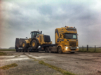 CAT 980k loading shovel on a low loader ready for transport.