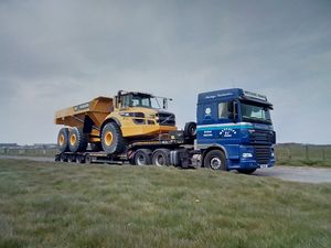 A Volvo A45 dump truck on a low loader