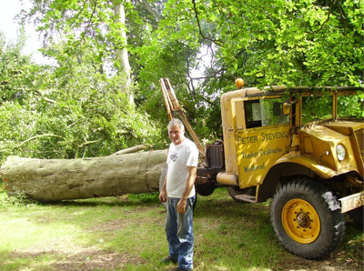 Peter Stevens in the mid-2000s in front of a modified gun tractor dating back to WWII