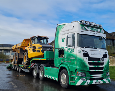 An SER Volvo A30G dumptruck on a Waitings lowloader