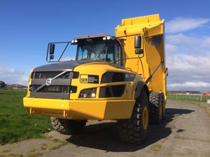 An SER Volvo A45G dump truck with body fully raised