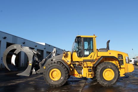 New Volvo L120G loading shovel with log grab for sawmill work.